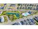 Picture of resort-style community featuring a scenic pond, sparkling pool, and neatly arranged homes with pristine landscaping at 28809 S Orange Berry S Dr, Wesley Chapel, FL 33543