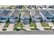 Aerial view of homes in a suburban neighborhood with well-kept lawns and tree-lined streets at 28809 S Orange Berry S Dr, Wesley Chapel, FL 33543