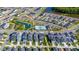 Expansive aerial view of a Primary-planned community featuring pristine landscaping and a resort-style community pool at 28809 S Orange Berry S Dr, Wesley Chapel, FL 33543
