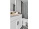 Bathroom featuring a modern vanity, stylish shower curtain, and tiled walls at 28809 S Orange Berry S Dr, Wesley Chapel, FL 33543