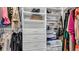 Organized walk-in closet with shelves, drawers, and hanging rods at 28809 S Orange Berry S Dr, Wesley Chapel, FL 33543