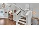 Grand entryway with hardwood floors, staircase, and elegant decor at 28809 S Orange Berry S Dr, Wesley Chapel, FL 33543