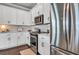 Bright kitchen with stainless steel appliances, white cabinets, and elegant countertops at 28809 S Orange Berry S Dr, Wesley Chapel, FL 33543