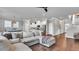 Open-concept living space featuring comfortable sectional sofa, kitchen and breakfast nook at 28809 S Orange Berry S Dr, Wesley Chapel, FL 33543
