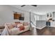 Inviting living room featuring hardwood floors, comfortable seating, and a built-in mini bar at 28809 S Orange Berry S Dr, Wesley Chapel, FL 33543