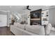 Cozy living room showcasing a modern fireplace, built-in shelves, and comfortable seating at 28809 S Orange Berry S Dr, Wesley Chapel, FL 33543