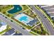 Aerial view of a luxury pool with lounge chairs, playground, and immaculate landscaping in a residential community at 28809 S Orange Berry S Dr, Wesley Chapel, FL 33543