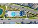 Capture of a Gathering-friendly community pool, playground, lounge chairs, and umbrellas creating an inviting atmosphere at 28809 S Orange Berry S Dr, Wesley Chapel, FL 33543