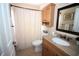 Bathroom with a shower and granite countertops on vanity cabinet and a framed mirror at 29650 Eagle Station Dr, Wesley Chapel, FL 33543