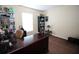 Comfortable room, featuring a desk, a large window and lots of storage space at 29650 Eagle Station Dr, Wesley Chapel, FL 33543