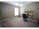 Bedroom with a ceiling fan, closet, desk, and natural light coming through the window at 29650 Eagle Station Dr, Wesley Chapel, FL 33543