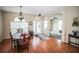 Dining room features wood floors, arched doorways, and chandelier at 29650 Eagle Station Dr, Wesley Chapel, FL 33543