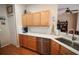 Well-equipped kitchen with stainless steel dishwasher, sleek faucet, and attractive wood cabinetry at 29650 Eagle Station Dr, Wesley Chapel, FL 33543