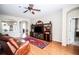 Inviting living room with hardwood floors and entertainment center perfect for relaxation and gatherings at 29650 Eagle Station Dr, Wesley Chapel, FL 33543