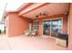 Backyard patio area with seating and a ceiling fan at 29650 Eagle Station Dr, Wesley Chapel, FL 33543