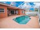 Backyard featuring a screened-in pool and patio at 29650 Eagle Station Dr, Wesley Chapel, FL 33543