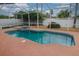 Inviting screened-in pool and spa area with a spacious deck for lounging at 29650 Eagle Station Dr, Wesley Chapel, FL 33543