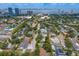 An overhead shot highlighting residential community with cityscape views and lush trees and greenery at 3404 W Leona St, Tampa, FL 33629