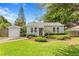 Charming single-story home with well-manicured lawn and lush landscaping at 3404 W Leona St, Tampa, FL 33629