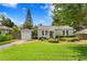 Charming single-story home with well-manicured lawn and lush landscaping at 3404 W Leona St, Tampa, FL 33629
