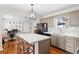 Modern kitchen with quartz countertops, island seating, and stainless steel appliances at 3404 W Leona St, Tampa, FL 33629