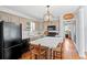 This kitchen features an island with seating and stainless steel appliances at 3404 W Leona St, Tampa, FL 33629