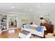 Comfortable living room with hardwood floors, ceiling fan, and an open doorway to the office at 3404 W Leona St, Tampa, FL 33629