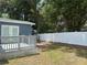 The backyard features a spacious deck and privacy fence creating a private outdoor oasis at 3718 N 36Th St, Tampa, FL 33610