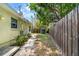 Backyard with a shed and wood fence provides storage and privacy alongside the home at 3919 W Paxton Ave, Tampa, FL 33611