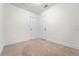 Bright bedroom featuring carpet, two closets, and neutral walls at 3919 W Paxton Ave, Tampa, FL 33611