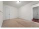 This cozy bedroom has neutral carpet and trim and lots of natural light at 3919 W Paxton Ave, Tampa, FL 33611