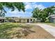 Charming one-story home with a well-maintained lawn and covered entryway at 3919 W Paxton Ave, Tampa, FL 33611