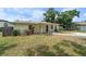 Well-maintained single-story home with a welcoming front yard and manicured landscaping at 3919 W Paxton Ave, Tampa, FL 33611