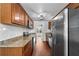 Modern kitchen with stainless steel appliances, granite counters, and a subway tile backsplash at 3919 W Paxton Ave, Tampa, FL 33611