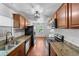 Galley kitchen with granite countertops, stainless steel appliances, and subway tile backsplash at 3919 W Paxton Ave, Tampa, FL 33611
