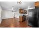 Open-concept kitchen featuring stainless steel appliances and hardwood floors at 3919 W Paxton Ave, Tampa, FL 33611