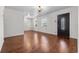 Bright living room with hardwood floors and decorative front door at 3919 W Paxton Ave, Tampa, FL 33611