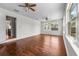 Spacious living room featuring hardwood floors, ceiling fans, and natural light at 3919 W Paxton Ave, Tampa, FL 33611