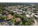 Neighborhood aerial view shows peaceful, tree-lined streets and a mix of single-Gathering houses and landscaping in a community at 4039 La Pasida Ln, New Port Richey, FL 34655