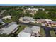 Overhead shot of community with lush greenery, showing the location of a single-story residence with convenient carport parking at 4039 La Pasida Ln, New Port Richey, FL 34655