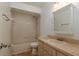 Neutral bathroom featuring a shower-tub combo, wood-look flooring, and a single-sink vanity at 4039 La Pasida Ln, New Port Richey, FL 34655