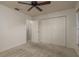 This bedroom features carpet flooring, a ceiling fan and large closet at 4039 La Pasida Ln, New Port Richey, FL 34655