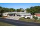 Charming single-story home featuring a covered carport, mature landscaping, and a welcoming facade, perfect for easy living at 4039 La Pasida Ln, New Port Richey, FL 34655
