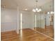Bright living room area features hardwood flooring and recessed lighting with a front door at 4039 La Pasida Ln, New Port Richey, FL 34655