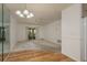 Spacious living room with a ceiling fan and sliding doors to the outside at 4039 La Pasida Ln, New Port Richey, FL 34655