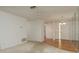 View of the spacious living room with a ceiling fan and hardwood flooring at 4039 La Pasida Ln, New Port Richey, FL 34655