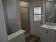 Bathroom featuring a toilet, shower, and sink at 405 Lemonwood Dr, Englewood, FL 34223