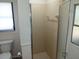 Bathroom featuring a shower and toilet at 405 Lemonwood Dr, Englewood, FL 34223
