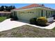 Charming home showcasing a well-manicured lawn and a neutral-toned garage door at 405 Lemonwood Dr, Englewood, FL 34223