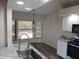 Bright kitchen featuring a sink with a window view and stainless steel appliances at 405 Lemonwood Dr, Englewood, FL 34223